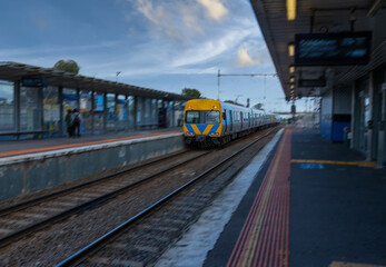 Commuter train approaching a train station in Melbourne Victoria Australia