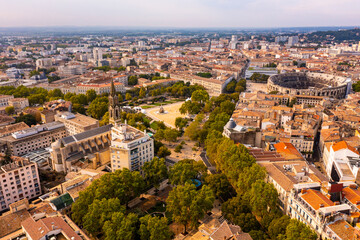 Fototapeta na wymiar Nimes Arena aerial panoramic view. Nimes is a city in the Occitanie region of southern France