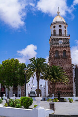 Fototapeta na wymiar Bell tower of the beautiful white town of Teguise. Photography made in Lanzarote, Canary Islands, Spain.