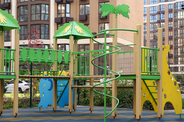 Fototapeta na wymiar Colourful outdoor playground for children in residential area
