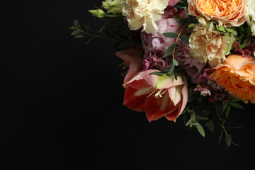 Beautiful fresh flowers on dark background, space for text