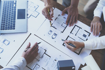 Construction and structure concept of engineer working drawing on blueprint meeting for project working with partner on model building and engineering tools in working site, construction concept