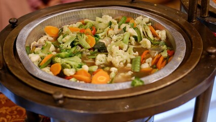Chinese food. capcay, cap cay or Chopsuey. Suttee Vegetables on brass bowl 