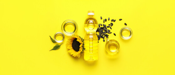 Composition with sunflower oil and seeds on yellow background, top view