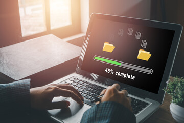 Transfer files data system relocation concept, Person hand using laptop computer waiting for transfer file process with loading bar icon on virtual screen. - Powered by Adobe