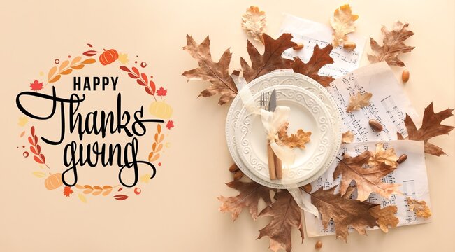Greeting card for Happy Thanksgiving Day with stylish autumn table setting on light background