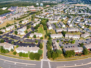 small winding streets, parking lots and roads in a residential area of a small town. Aerial view of