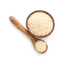 Wooden bowl and spoon of sesame seeds isolated on white background