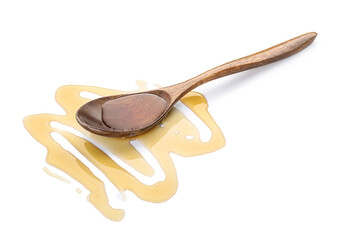 Wooden spoon with tasty maple syrup on white background