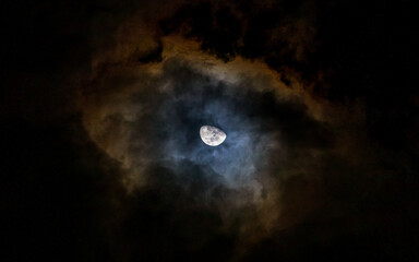 Naklejka na ściany i meble Moon out of the night sky like retina