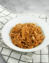 Favorite dish stir fried noodles or locally known as MIe Goreng. Selective focus.