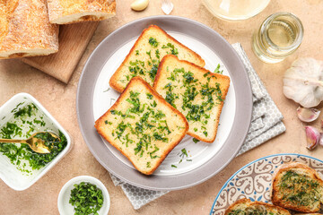 Composition with plate of toasted garlic bread and ingredients on color background