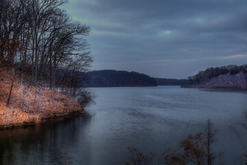 Lake Kincaid on a Winter Evening. Clouds have gathered to catch the last rays of sunshine. 
