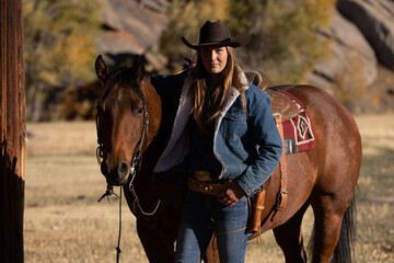 Wyoming Cowgirl at Work in the Fall - obrazy, fototapety, plakaty