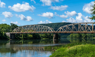Fototapeta na wymiar The Tidioute Bridge spanning over the Allegheny River in Warren County, Pennsylvania, USA on a sunny summer day