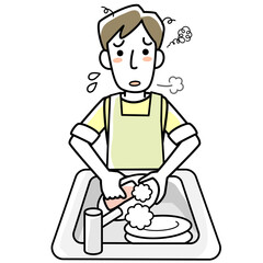 疲れた表情で食器洗いをする若い男性
