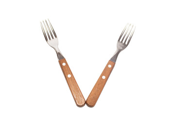 2 forks with wooden handles making the letter V on a white background