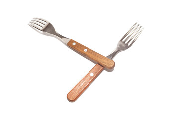 2 forks with wooden handles making the letter Y on a white background