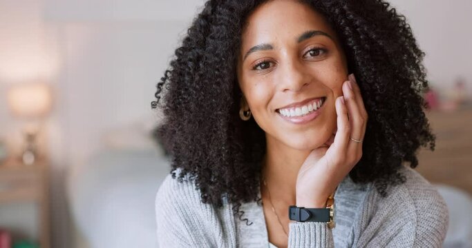 Happy black woman, smile and teeth in the bedroom at home in joy, relax and comfort in happiness. Portrait of a beautiful Brazilian female smiling and relaxing with hand on her face in a house.