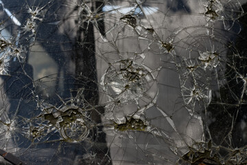 Broken, cracked car windshield. Close up.
