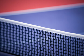 Blue and smooth surface table tennis table with tight black net to being prepared for practice and competition.