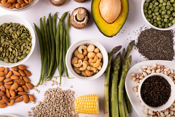 Directly above view of healthy food and ingredients arranged on white table, copy space