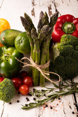 Close-up of various fresh vegetables on white wooden table