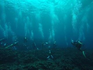 Fototapeta na wymiar Scuba diving into coral garden at Ishigaki island, Japan