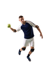 Full length of young male caucasian player playing handball while throwing against white background