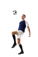 Full length of skilled caucasian male player kicking ball against white background