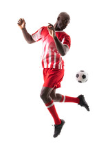 Fototapeta na wymiar African american young male soccer player controlling ball against white background