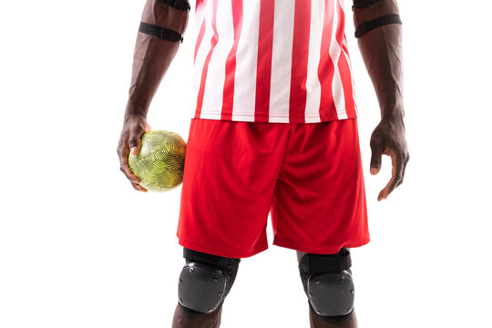 Midsection of african american handball player wearing protective guards holding ball