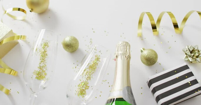 Decorations and champagne on white background at new year's eve