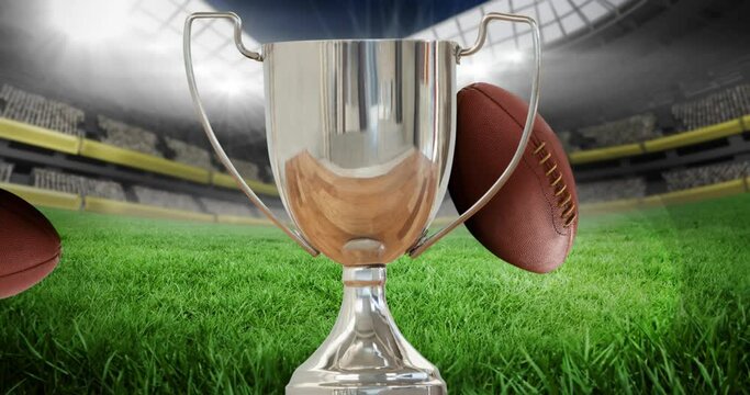 Animation of silver cup with rugby balls in rugby field sports stadium