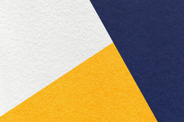 Fototapeta na wymiar Texture of craft navy blue, white and golden shade color paper background, macro. Vntage abstract indigo cardboard