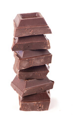 chocolate pieces. dark chocolate bars stacked high