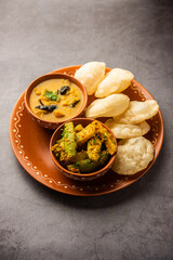 Cholar dal and patol aloo sabzi served with fried Luchi or poori, bengali food - obrazy, fototapety, plakaty