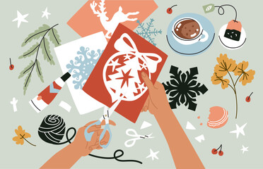 Women's hands cut decor for home decoration. Creative process. Handmade, creating Christmas decorations, congratulations and cards. Happy holiday. Flat style in vector illustration.