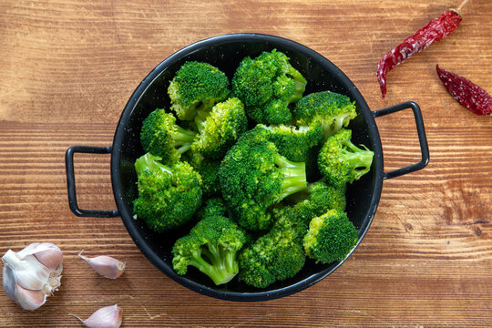 vegetarian food boiled broccoli in metal pan 