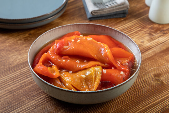 cooked red peppers with garlic in sauce 