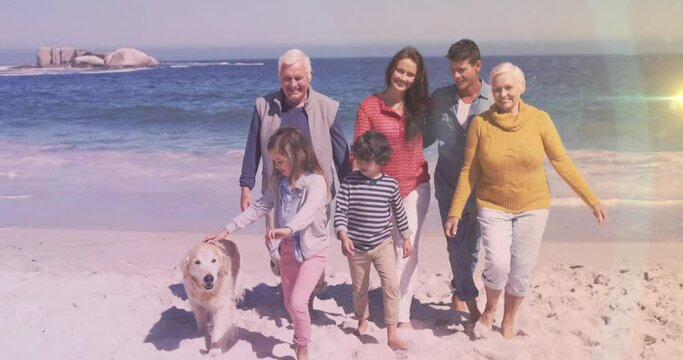 Animation of light spots over happy caucasian family at beach - Powered by Adobe