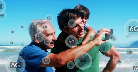 Animation of 6g texts over happy biracial family taking photo at beach