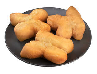 Youtiao Chinese Donut Stick on black plate isolated on white background, Golden brown deep fried breadsticks on White Background PNG file.
