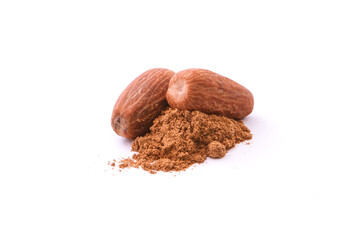 Dry nutmeg with powder isolated on white background.