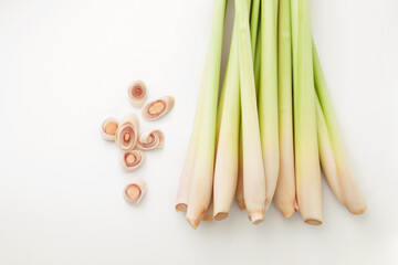 Fresh lemongrass with slice on white paper background , top view , flat lay.