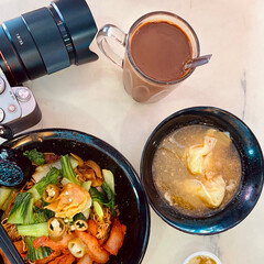 Singapore Wanton Noodle, Malaysian Noodle and Hot Coffee with Camera on table in Singapore.