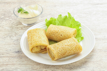 Stuffed pancakes with meat and cream