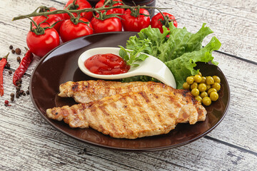 Grilled pork steak with ketchup