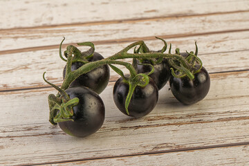 Ripe tasty black cherry tomato