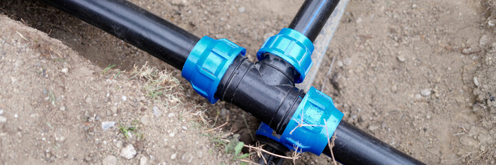 Equipment for automatic watering soil pipes lying in ground closeup